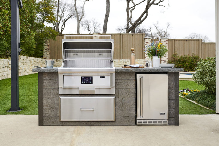 Coyote built-in pellet grill in an outdoor kitchen island