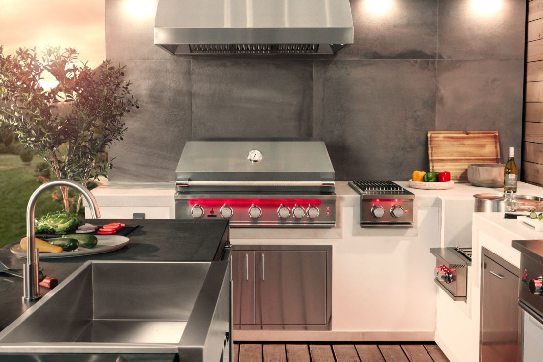 TrueFlame outdoor vent hood installed above a built-in grill
